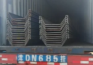Z-type steel sheet piles loaded and secured inside a shipping container